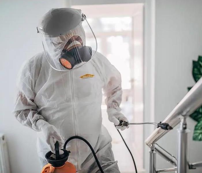 SERVPRO Technician cleaning in PPE